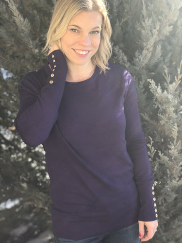 purple pullover sweater with gold buttons