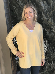 Soft yellow sweater with center seam